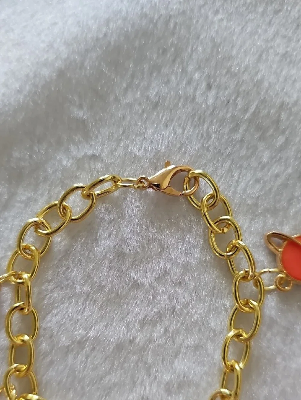 Gold Space Themed Charm Bracelet with Orange and Black Accents